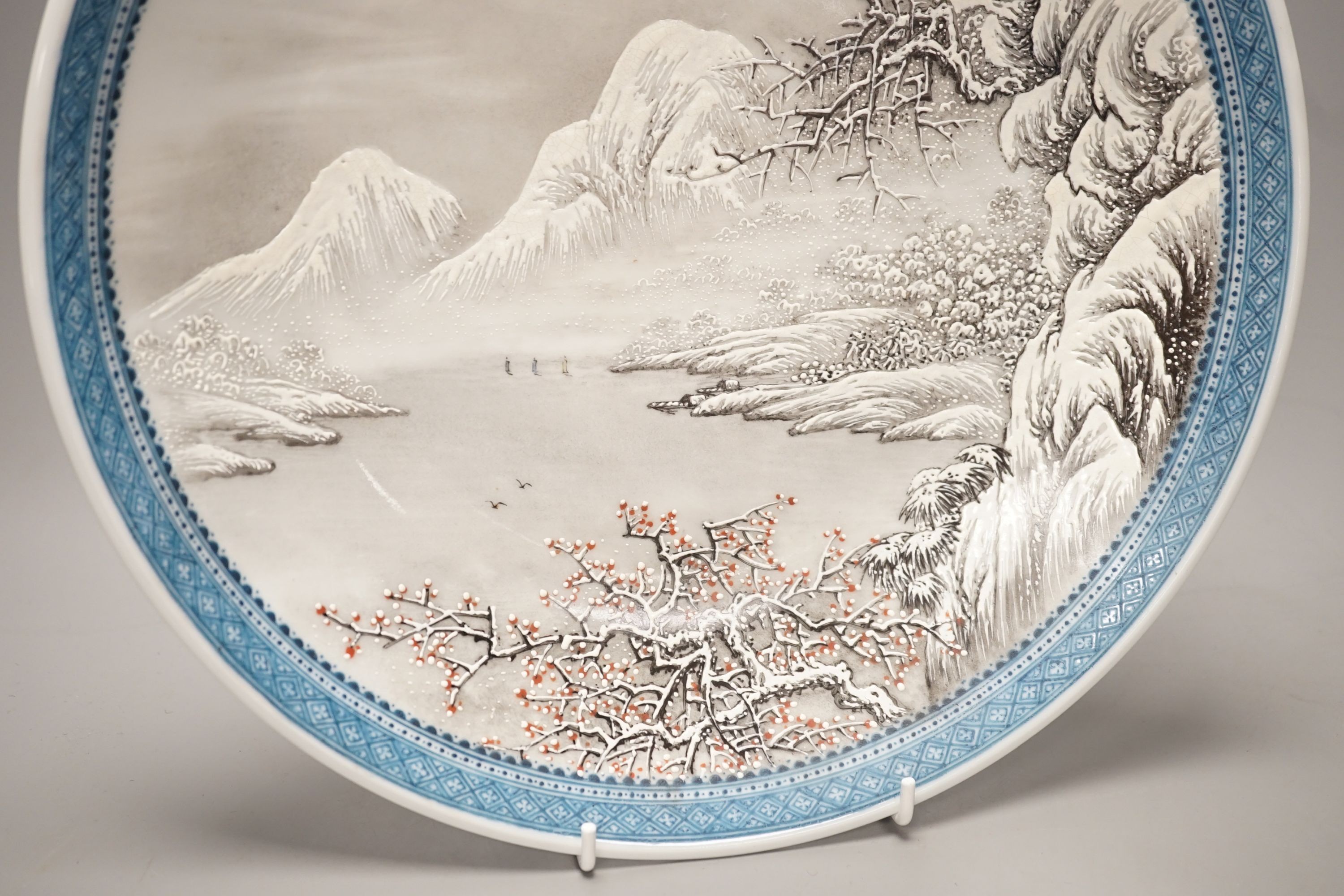 A Chinese enamelled porcelain snow scene dish, diameter 31cm, and a similar smaller eggshell bowl